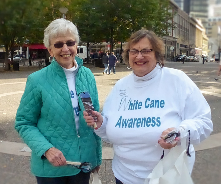 Page Image Values 720x600 Two visually impaired women participating in the White Cane Awareness event